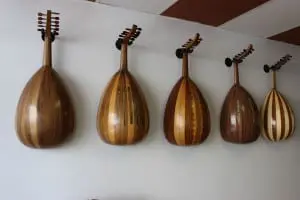 A display of ouds lines a wall at Lord of the Strings.