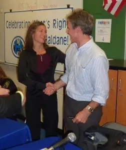 Peter Henderson accepts congratulations from Trustee Jennifer Daly after the news of his re-election to the Haldane Board of Education. (Photo by P. Doan)