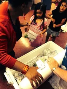 Children at Davies South Terrace receiving their free summer lunch. 