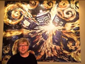 Shirley Hot, owner of Beacon's The Pandorica, in front of an "exploding tardis."