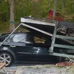 Part of the house collapsed onto the resident's car.