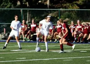 Bailey McCollum, #2, finesses the ball against Arlington B at home on Sept. 19.
