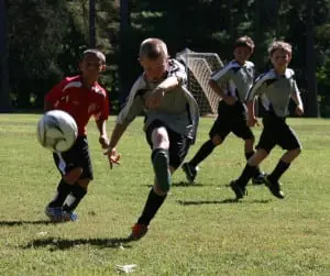 Evan Maasik controls the ball for Philipstown Soccer Club Arsenals, with Matteo Cervone and Patrick DiNardo, as they take on the Wappingers Wolverines on Sept. 7, at Philipstown Park.