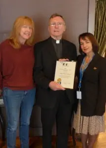 Cathryn Fadde, Owner of Cathryn’s Tuscan Grill, Fr. Robert Warren, SA, and Loretta Molinari, Visiting Nurse Services Westchester, celebrate the friar’s Distinguished Service Award given by the Putnam Community Service Network.