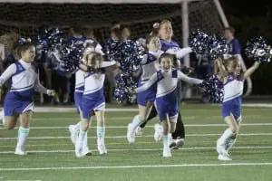The Philipstown Hawks Cheer Squad takes the field during halftime at the Haldane Homecoming game on Sept. 26.