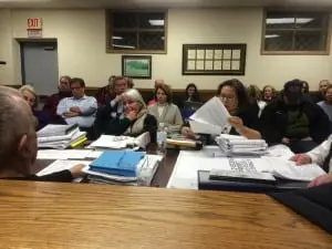 Anna Georgiou (holding paper) reads from her statement on the Butterfield review process. (Photo by K.E. Foley)
