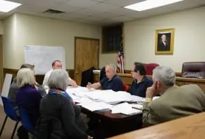 Arne Saari, center, tells his Planning Board colleagues of his concerns about parking at the proposed Butterfield redevelopment.