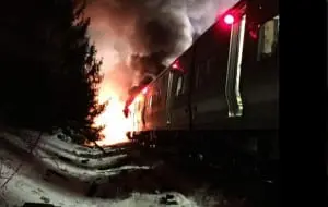 A photo of the burning and wrecked Harlem Line train.
