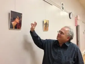 Photographerâ
Markieâ
Baylashâ
givesâ
aâ
commentaryâ
ofâ
theâ
imagesâ
onâ
displayâ
inâ
theâ
exhibitionâ
ofâ
hisâ
workâ
atâ
theâ
Howlandâ
Library (Photoâ
byâ
A.â
Rooney)