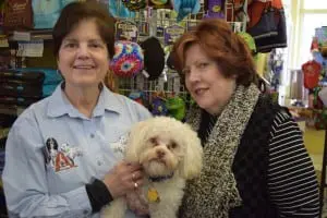 Mary Jane Nagel, left, and her partner Susan Elliot-Nagel with Buster, owners of Reigning Dogs and Cats Too, which will close April 1