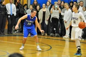 Ryan McCollum, left, and Blue Devil defense deny Putnam Valley.