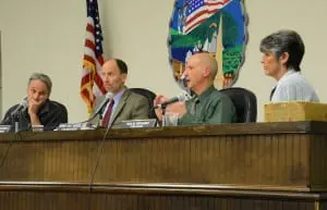 Councilor John Van Tassel (second from right) makes a point as Councilor Dave Merandy (left), Supervisor Richard Shea (second from left) and Town Clerk Tina Merando listen.