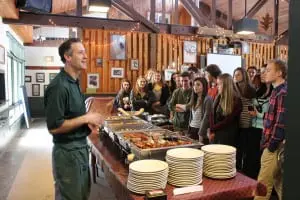 Mike Gasparri of the Taconic Outdoor Education Center explains each of the international lunch offerings to hungry Haldane students at Immersion Day 2015.