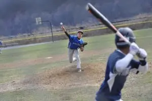 Haldane pitcher Brian Haines pitches the Blue Devils to a 12-9 win over the visiting Poughkeepsie Pioneers on Saturday, April 11, at Mayor's Park in Cold Spring.