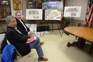 Framedâbyâdrawingsâfromâtheirâproject,âButterfieldâdeveloperâPaulâGuillaro,âleft,âwithâmembersâofâhisâredevelopmentâteam,âMattâMoranâandâRayâSullivan,âawaitâtheâstartâofâtheâpublicâhearing.