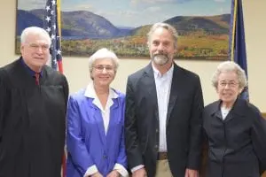 Judge Thomas Costello, left, presided over swearing-in ceremonies for Trustee Fran Murphy, Mayor Dave Merandy and Trustee Marie Early. (Photo by Michael Turton)