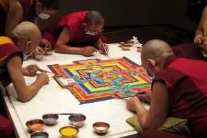 Tibetan lamas of the Drikung Kagyu lineage creating a sand mandala at Asia Society, New York, 2014. (Photo by Karen Lucic)