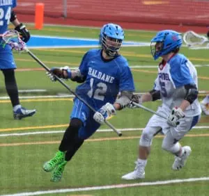 Haldane Blue Devil defender Nick Allen (12) shuts down Carmel April 1. (Photo by Kim Giachinta)