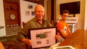 Stewart receiving a framed memento of the website Philipstown.info (file photo)