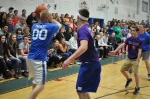 Haldane Teacher Simon Dudar, left, takes on Haldane students in a basketball fundraiser held on Friday, May 1, in front of standing-room-only crowd.