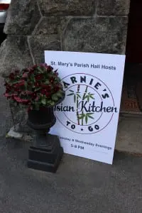 The signboard outside of St. Mary's Parish Hall alerts fans of Asian food to the arrival of Marnie's Asian Kitchen to Go.