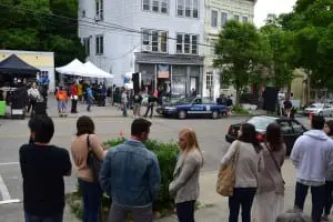 Acting extras (foreground) await their turn to walk through one of the Main Street scenes.