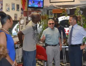 County Executive Molinaro and Beacon Mayor Casale chat with Main Street Beauty Club owner Michael Bell, with Dutchess County Legislator April Farley and Beacon Councilman Ali Muhammad.