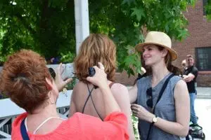 An actress receives a last-minute touch-up to hair and makeup just before a scene is shot.