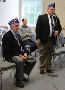 Purple Heart veterans Eugene Lang and Neil Gross, at the microphone, invite the Town Board to make Philipstown a Purple Heart community. Photo by L.S. Armstrong