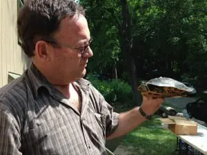 Professor Louis du Preez holds a painted turtle. (Photo by P. Doan)