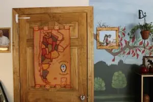 A portrait of Pope Francis, a map of Argentina and a hand-painted mural depicting the countryside form part of the decor of Rincon Argentino.