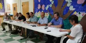 Town officials open the paving forum; from left, consulting engineer Ron Gainer, Highway Superintendent Roger Chirico, Councilors Robert Flaherty and Nancy Montgomery, Supervisor Richard Shea, Councilors John Van Tassel and Mike Leonard, Town Clerk Tina Merando.