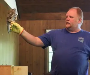 Special guest at the Hudson Highlands Nature Museum's June 7 owl presentation: a screech owl, held by wildlife educator Carl Heitmuller