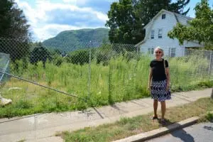 Anne Imellizzeri on the site of the former house
