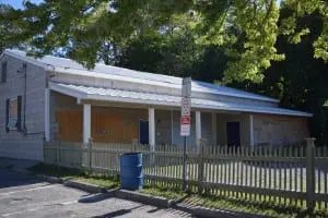 The Boat Club building has been boarded up and will be razed.