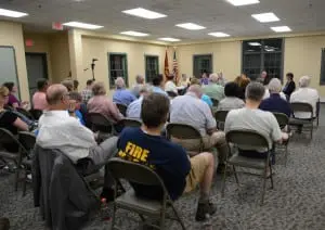 A rapt audience fills the Garrison firehouse meeting room for a public hearing, convened by the Town Board