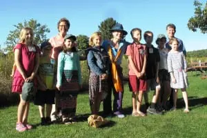 Hudson Highlands Nature Museum director Jackie Grant, River of Words educator Irene O’Garden and Hudson Highlands Land Trust director Andy Chmar with student poets at the opening