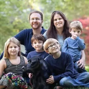 TheâWeinerâfamily,âincludingâLucsâ(thirdâfromâleft,âfrontârow)âwithâhisâserviceâdog,âRaphael.ââ(PhotoâcourtesyâofâGuidingâEyesâforâtheâBlind.)