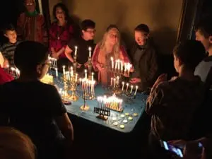 Sharing stories about family menorahs as the PRS service. (Photo provided)