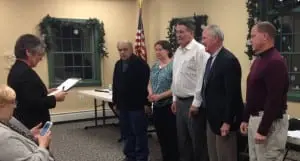 Town Clerk Tina Merando, swears in the new Garrison Fire Commissioners -- Joseph Mercurio, Sandra Bohi, David Brower, Nat Prentice, and Rodney Tudor -- on Jan. 6 at the Garrison Firehouse. (Photo provided)
