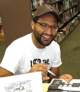 JMâSupervilleâSovak,âsigningâcopiesâofâhisâworkârecentlyâ(photoâprovided) 