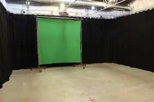 The 700+ square foot soundstage doubles as a screening room, with benches stored behind the curtains.  (Photo by A. Rooney)