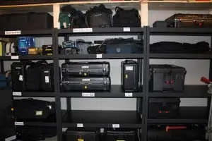 Shelves at The CineHub, filled with rental equipment, including teleprompters, monitors, rain hoods, tripods and cameras. (Photo by A. Rooney)