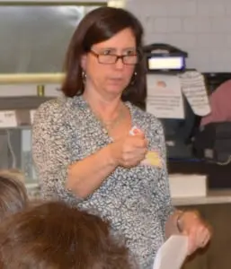 Karen Michella speaking to a group of women gathered at Garrison Café (photo by Patti Pelican) 
