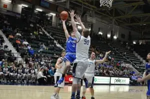 David Rotando goes for two against Moravia in the Class C semifinals on March 11 at the Glens Falls Civic Center. (Photo by Peter Farrell)