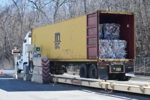 Bales are loaded into a truck to be delivered to manufacturing customers (photo by M. Turton) 