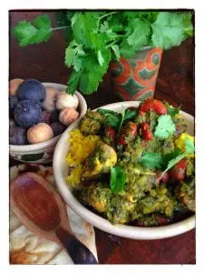 Persian Herb and Red Bean Stew with Chicken. Black and white dried Persian limes—limu omani—are in the bowl to the left. (Photo by J. Dizney)