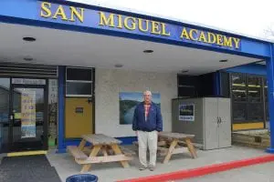 Fr. Mark Connell, pictured in front of San Miguel Academy. (Photo by A. Rooney)