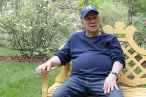 Arthur Ross telling the story of how he built his gardens amid 10 acres of thick forest. (Photo by A. Peltonen)