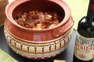 The Bulgarian "guvech," a large clay cooking pot, goes from oven to table. (Photo by M.A. Ebner)